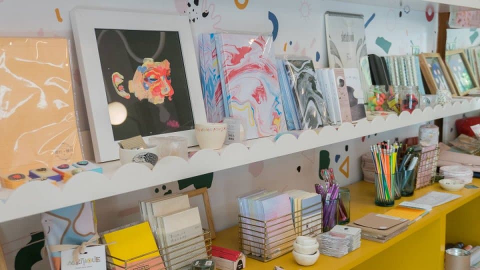 paintings on a shelf at Nimia GDL