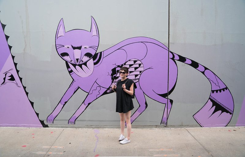 Woman in front of mural in RiNo, Denver