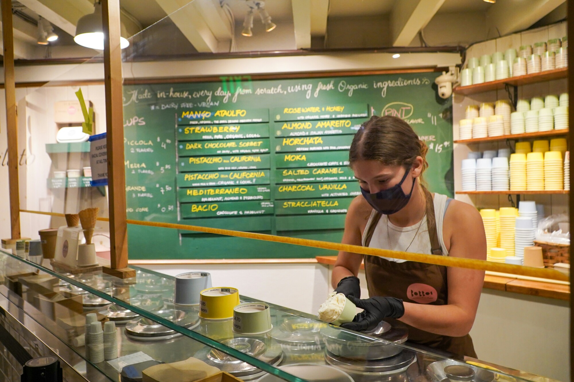 A woman working in a shop in La Jolla by the Sea in California