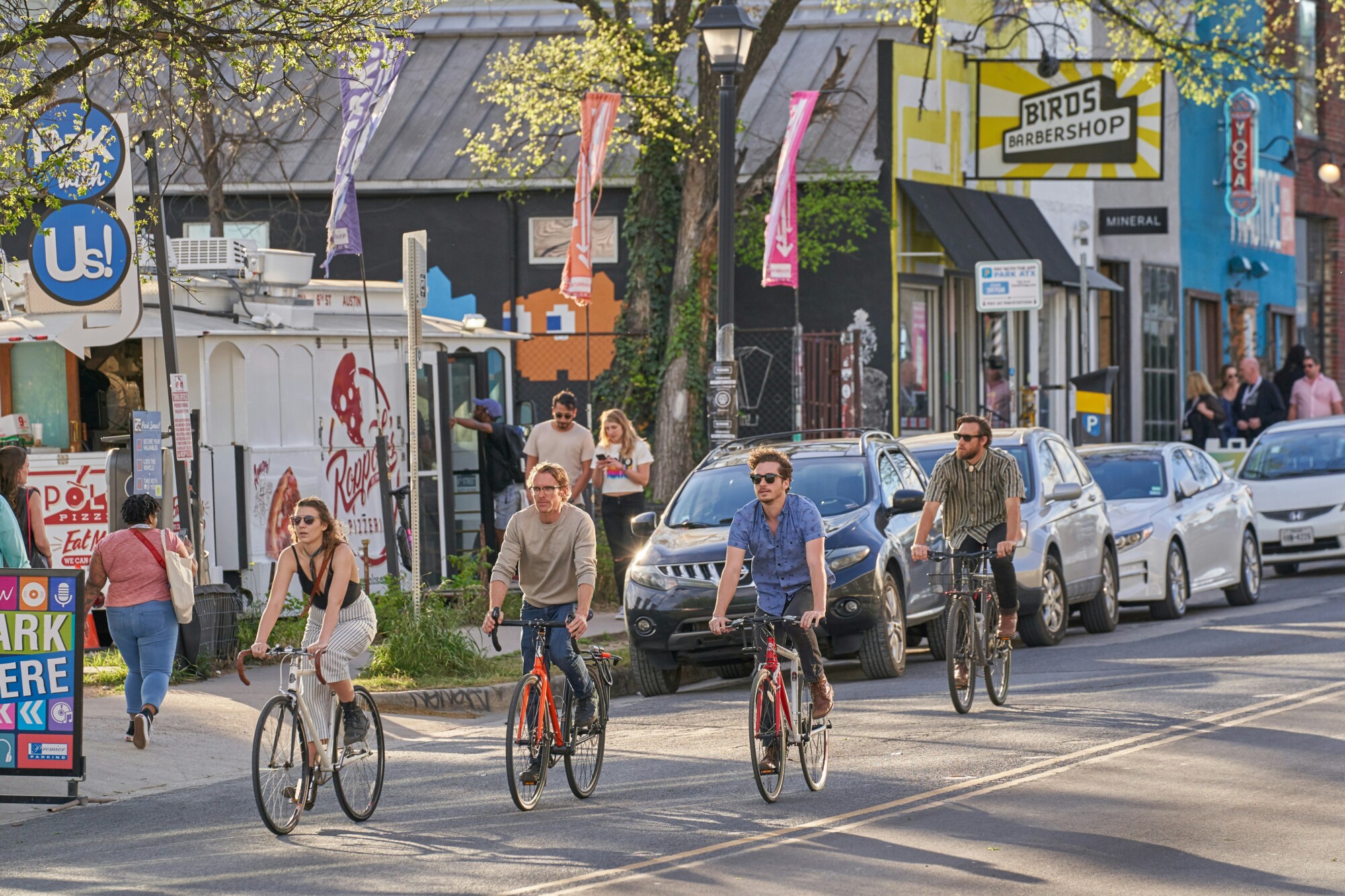People riding their bikes around town