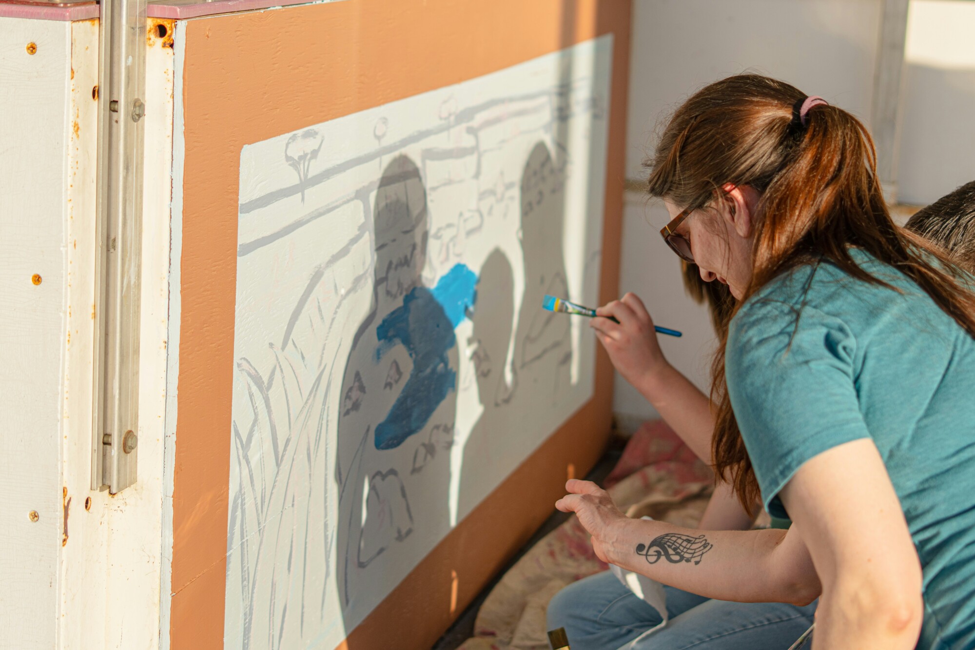Woman painting public art
